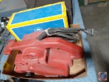 Milwaukee belt sander and 2 boxes of belts.