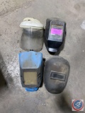 3 welding helmets and a face shield.