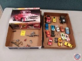 Two boxes of 1956 Ford F1 hundred more cuter dinosaurs look like a dungeon and dragons game and some