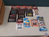 Several packages of hot wheels in blister packs