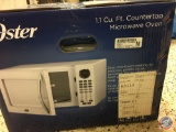Oster 1.1 Cu. Ft. Countertop Microwave Oven (New In Box)