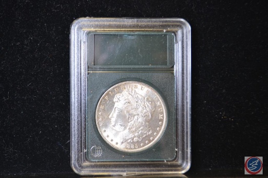 1885 $1 Double Eagle in a slab but not graded, slab has been opened