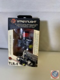 Streamlight Rail Mounted Tactical LED Flashlight and Lase, New in package. (some water stains...on