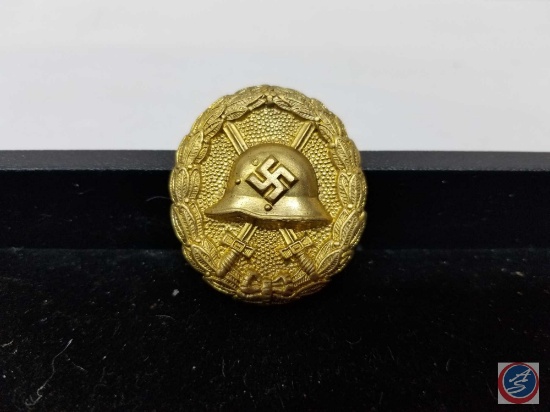 German WWII Gold Condor Legion Wound Badge with German Helmet in Center with Pair of Crossed Swords