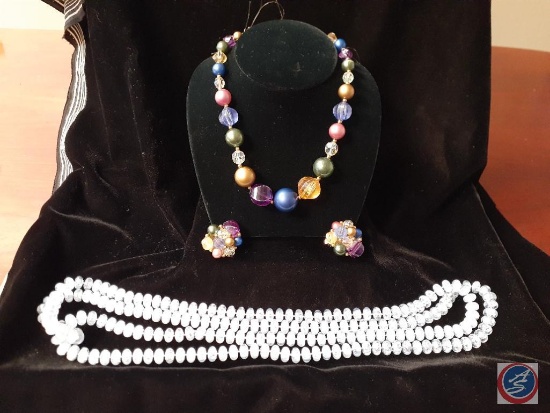 Large multi color beaded necklace and earrings, and a clear blue bead necklace