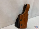 Galco paddle holster for 1911 combat commander pistol.