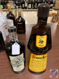 Bottle of blackmaker liqueur and a bottle of Frangelico liqueur