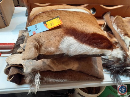 The Namib Collection Throw Pillow and Three Fur Pelts