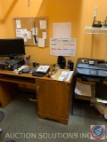Office desk, two shelving units, computer, and office supplies. Printer not included