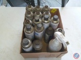 Canisters of 3M Fuel Injector Cleaner, Motocraft Fuel Injector Cleaner and Wynn's Air Intake Cleaner