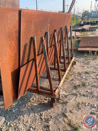 Rack on casters holding 4 x 190 x 1/4 inch steel sheet, 4 x 8 x 1/4 inch. 2 x 8 x 3/16 sheets steel