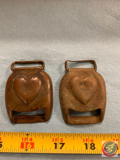 Two harness buckles appear to be copper