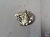 Pin with a horse on it