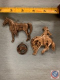 Western saddle horse bucking bronco and a horse head charm