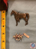 Sterling silver saddle horse and a sterling silver pin with three horses trotting through a