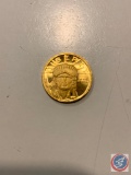 Weighing 1/10oz .999 pure Gold Liberty Round