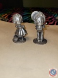 Pewter, Boy and Girl, each posing for a kiss