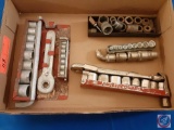 Assorted socket wrench sets.