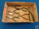 (1) Assorted items; channel locks, needle nose pliers.