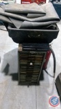 Metal File Cabinet, empty plastic cases, Fire extinguishers, Inner tube, oil pan, etc.