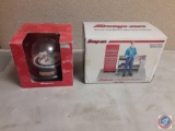 (1) Snap-On Snow Globe, (1) Snap-On Mechanical Bank.