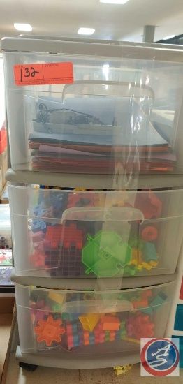 One 3 Drawer Plastic Cabinet on wheels, top drawer contains assorted paper, other 2 drawers contain