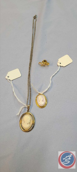 (3) Pink ribbon pin, cameo on pink back necklace pendant, Gold tone chain with cream cameo pendant..