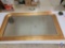 rectangle type goldish framed mirror rounded top corners... pointed lower corners... 26 t x 46 w...