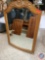 large wooden framed out lining mirror... design on top approx 32 x 48 ...