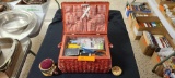 Sewing box with supplies, Glass snowman cutting board, towels and wrought iron miniture toy stove...