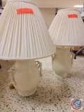 (2) white lamps with white lamp shades...