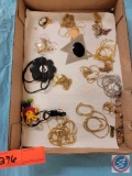 Assortment of gold and silver chains, some with pendants...