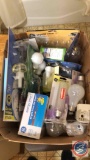 Light Bulbs, Nail care organizer, box of bathroom rugs, box of bathroom items , candles and beauty