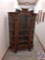 Antique oak china cabinet w/ curved glass & hand carved dragons & scroll. 5 shelves w/ lock & key. H