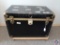 US Trunk Company flattop, black, steamer trunk w/ gold fittings. Handles in good condition. No