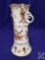Delicate flowered vase w/ scroll handles. H 10?. Mark: (ES ISH Prussia.) Chip on rim and handle.
