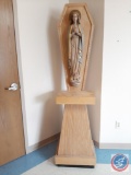 Carved wooden statue of Mary mounted on wood pedestal (included). Statue: 19?W x 38?H. Metal bar for