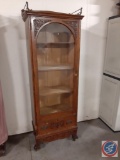 Antique china cabinet w/ hand carved decor & glass door on casters. 4 shelves and bottom drawer. ...