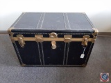 Large black flattop steamer trunk w/ metal fittings & gold rivet accents. Blue interior w/ 2 trays,