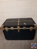 Large black flattop steamer trunk w/ metal fittings in excellent condition. 1 inside tray w/ good