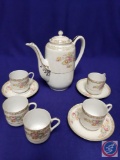 Porcelain tea set. Teapot w/lid H 6.5?, 5 demitasse cups, 3 saucers. (Mark: MK Made in Occupied