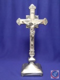 Self-standing 19? silver-plated crucifix on square base. Inscribed: ?Donated by Andrews, Culhane,