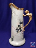 Vintage hand-painted, porcelain pitcher with pink flowers and grapes. Gryphon handle w/gold trim. H