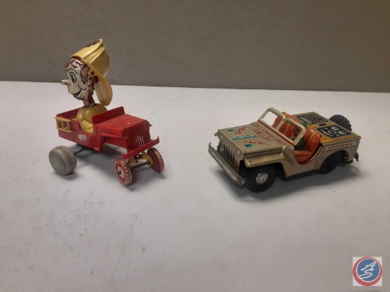 1 vintage windup plastic Jeep does not work and one tin jeep