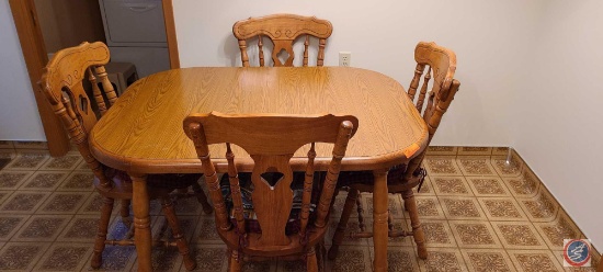 Oak kitchen table with 4 chairs with cushions and 2 leaves for table....