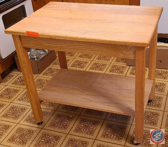 Kitchen island with Shelf on coasters...