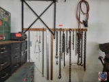 Assorted Chains, Wood Yard Stick, Metal yard Stick, Jumper Cables, Tie down straps and a set of