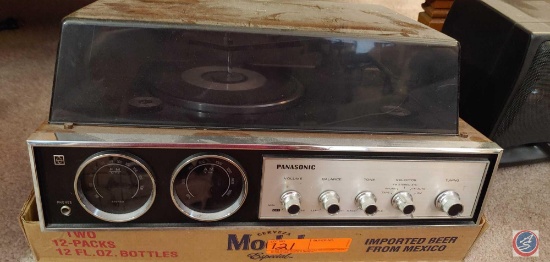 Panasonic AM/FM radio and turntable music center, model SD-84 and flat with cassette tapes and cd's.