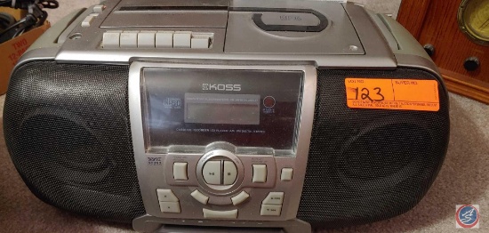 Koss...portable compact disc system with radio and cassette player, model PC68,...