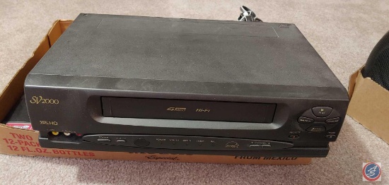 Philips video cassette recorder, Model SVA-106AT22 and LG DVD player, model DN898 with variety of